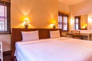 Coco Palm Beach Resort - SHA Extra Plus客房内的一张或多张床位