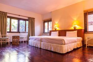 Coco Palm Beach Resort - SHA Extra Plus客房内的一张或多张床位