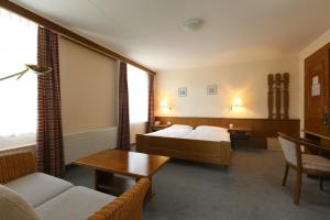 Postel nebo postele na pokoji v ubytování Hotel Concordia