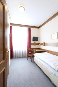 Postel nebo postele na pokoji v ubytování Hotel Concordia