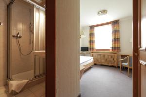 Postel nebo postele na pokoji v ubytování Hotel Concordia