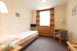 Postel nebo postele na pokoji v ubytování Hotel Concordia