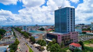 an aerial view of a city with a tall building at Muong Thanh Luxury Buon Ma Thuot Hotel in Buon Ma Thuot