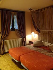 Ένα ή περισσότερα κρεβάτια σε δωμάτιο στο Hotel Areulo