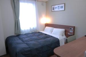 Letto o letti in una camera di Hotel Econo Tsu Station