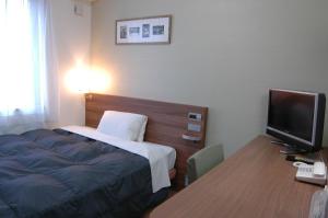 Letto o letti in una camera di Hotel Econo Tsu Station