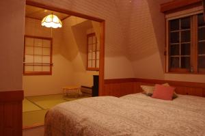 Resort Garni CORU tesisinde bir odada yatak veya yataklar