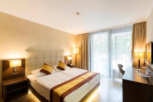 Postel nebo postele na pokoji v ubytování Hotel Sacher Baden