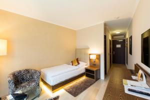 Postel nebo postele na pokoji v ubytování Hotel Sacher Baden