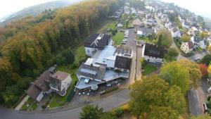an aerial view of a large house in a town at Landhotel Westerwald in Ehlscheid