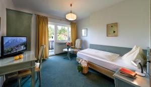 TV a/nebo společenská místnost v ubytování Hotel & Appartements Perwanger