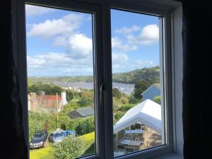 a window with a view of a body of water at The Red Lion Inn in Dittisham