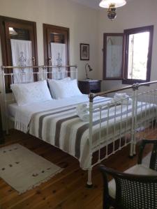 Кровать или кровати в номере Pension Panos