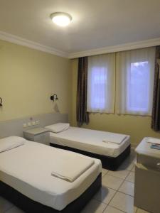 Кровать или кровати в номере Sailor Apart Hotel
