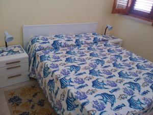 Cama ou camas em um quarto em HOME HOLIDAY PINO&FABIANA