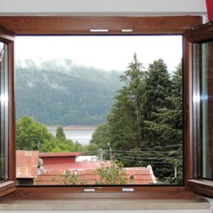 a window with a view of a mountain at Lorica Suite in Lorica