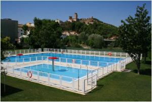 a large swimming pool with aicrobialicrobialicrobialicrobial at Casa Rural Runa in Miranda de Arga