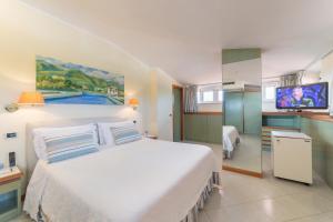 A bed or beds in a room at Hotel Eden