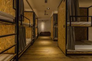 En eller flere senger på et rom på Mini Voyage Hostel