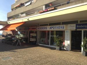 a store front of a building with a sign that reads buglers apprentice at Connie's House Holiday Apartment in Heidelberg
