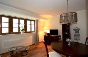 a living room with a table and chairs and a dining room at City Exklusiv II in Dresden
