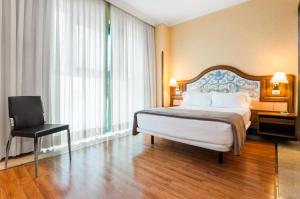 Postel nebo postele na pokoji v ubytování Hotel Julia