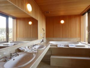 a bathroom with two sinks and a large mirror at Ryogoku View Hotel in Tokyo
