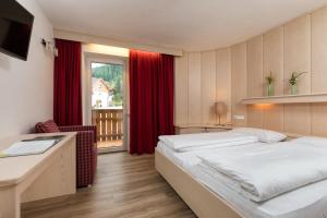 Postelja oz. postelje v sobi nastanitve Hotel Christian