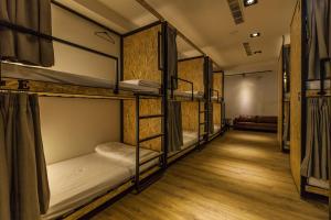 En eller flere senger på et rom på Mini Voyage Hostel