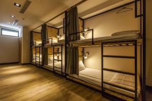 En eller flere senger på et rom på Mini Voyage Hostel