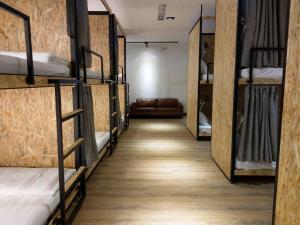 En eller flere senger på et rom på Mini Voyage Hostel