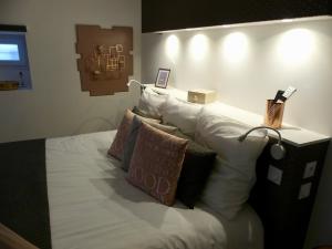 Postel nebo postele na pokoji v ubytování Entre Nous - La Poste