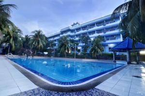 a large swimming pool in front of a building at Pelangi Hotel & Resort in Tanjung Pinang 