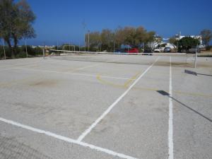 an empty parking lot with a tennis court at Blue Beach Villas Apartments in Stavros