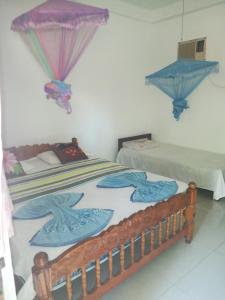 Ένα ή περισσότερα κρεβάτια σε δωμάτιο στο Walawe Park View Hotel