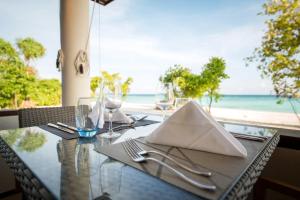 A restaurant or other place to eat at ROBINSON NOONU - All Inclusive