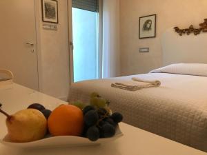 Postel nebo postele na pokoji v ubytování Hotel "La Salute"