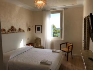 Postel nebo postele na pokoji v ubytování Hotel "La Salute"