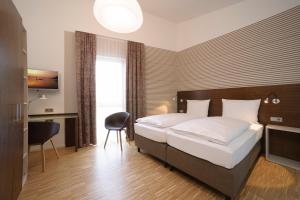 Postel nebo postele na pokoji v ubytování Seehörnle Bio Hotel & Gasthaus