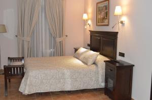 Postel nebo postele na pokoji v ubytování Hotel Don Javier