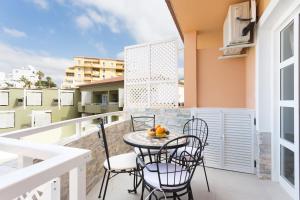 a balcony with a table and chairs on it at Orlando Apartment La Laguna 2 in Adeje