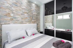 Llit o llits en una habitació de Orlando Apartment La Laguna 2