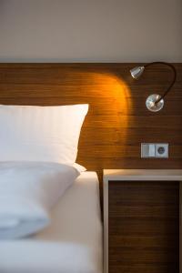 Postel nebo postele na pokoji v ubytování Seehörnle Bio Hotel & Gasthaus