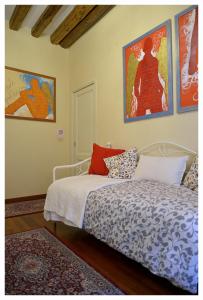 Giường trong phòng chung tại Domus Dea