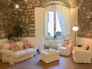 a living room filled with furniture and a fireplace at S'O Smart B&B Tropea in Tropea