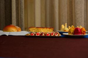 a table with two plates of food on it at Terrazzo su Ibla in Ragusa