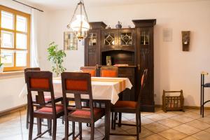 a dining room with a table and chairs at Ferienhaus Marie in Bremm