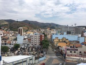 a view of a city with buildings and cars at Hotel Santa Rita in Aparecida