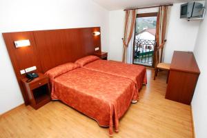 Postel nebo postele na pokoji v ubytování Hotel Agorreta