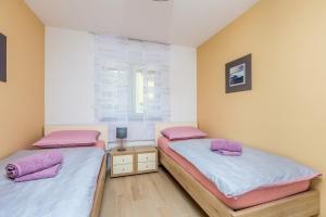 Postel nebo postele na pokoji v ubytování Villa Nika